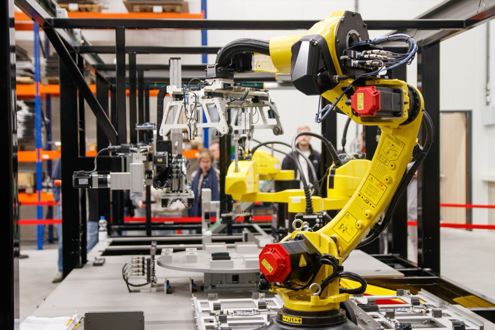 Industrial robot arm running on an automated production cell.